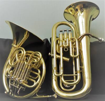 Penny Tedd music tutor and teacher room with French Horn and Euphonium. Trumpet, piano, and cello are out of shot. Online or travel to West Sussex.
